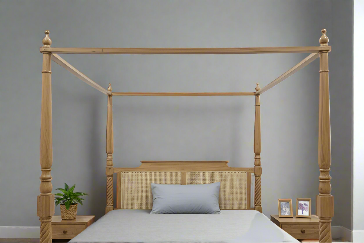 Wooden four-poster bed with gray bedding in a minimalistic bedroom.