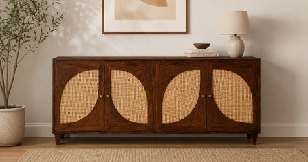 Handcrafted solid wood rattan sideboard placed against a living room wall with modern decor