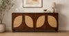 Handcrafted solid wood rattan sideboard placed against a living room wall with modern decor