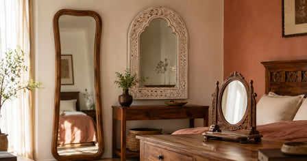 Three types of wooden mirrors in a bedroom — a full-length wall mirror, a hand-carved arched wall mirror, and a dressing table mirror