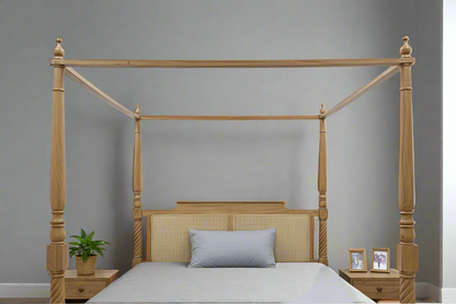 Wooden four-poster bed with gray bedding in a minimalistic bedroom.