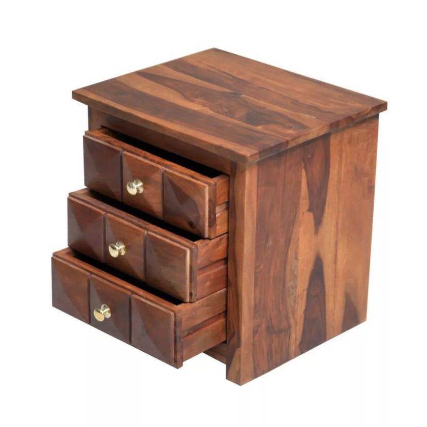 Wooden nightstand with three drawers on a white background