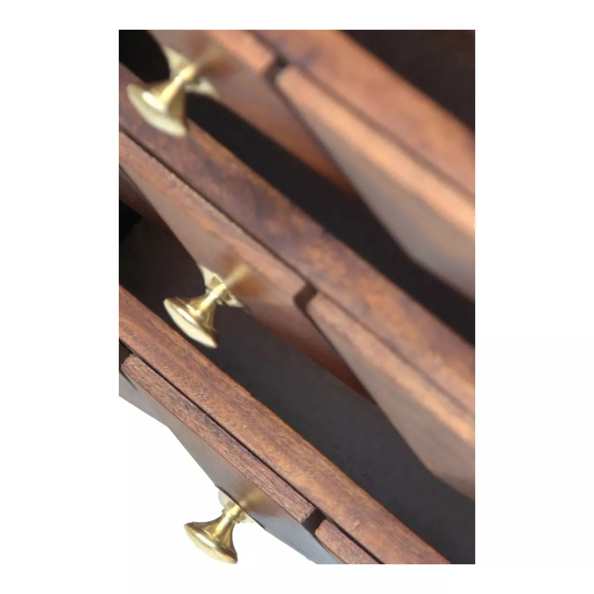 Wooden drawer with brass handles on a white background