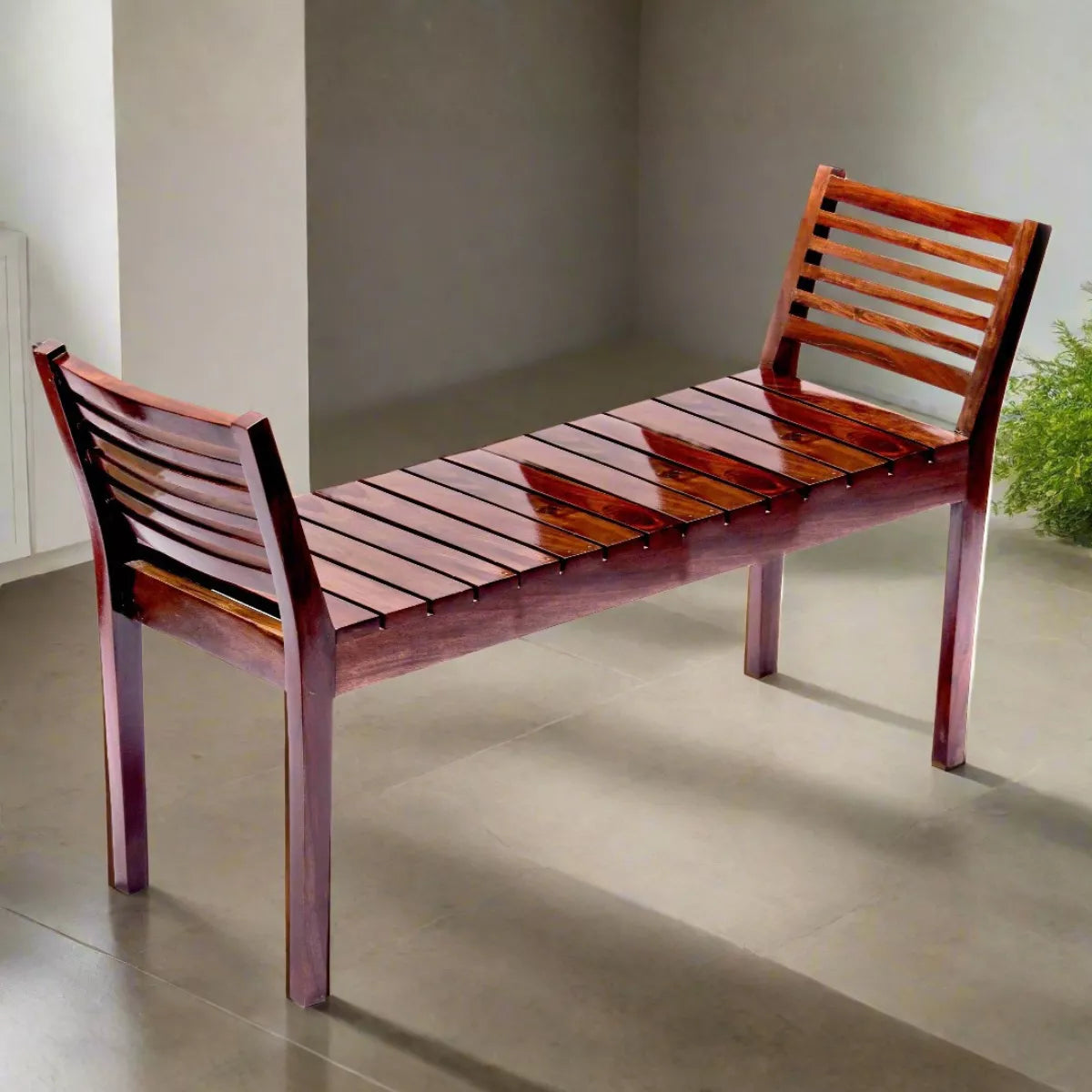 Wooden bench with slatted design on a concrete floor.