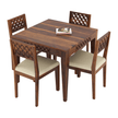 Wooden dining table set with four chairs on a white background