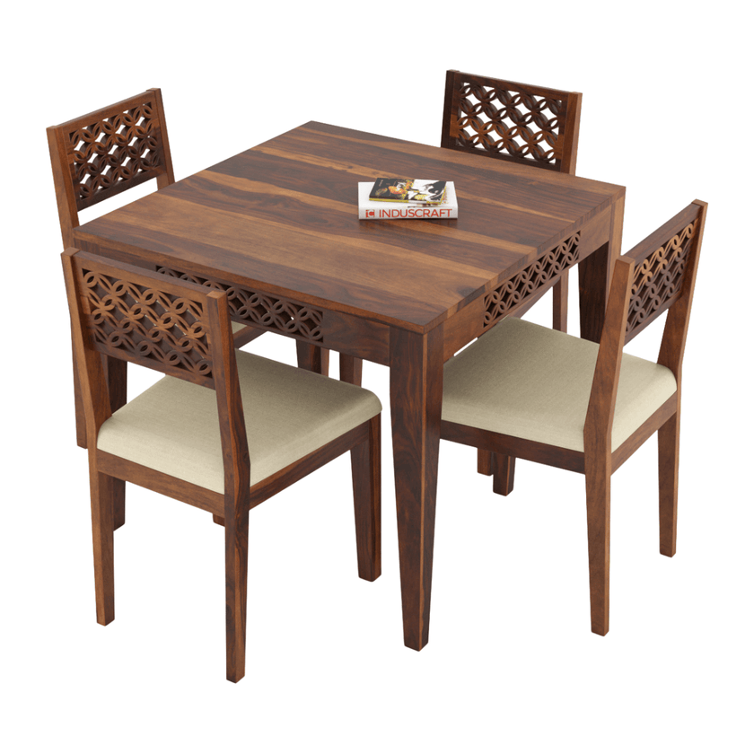 Wooden dining table set with four chairs on a white background