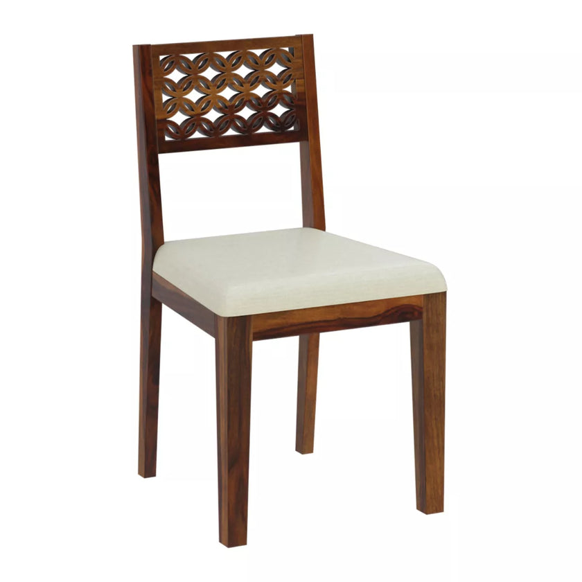 Wooden chair with a decorative backrest and white cushion on a white background