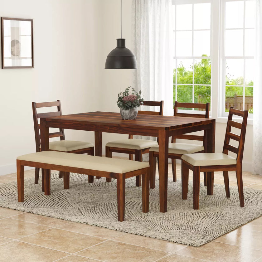 Wooden dining set with table, chairs, and bench in a bright room.