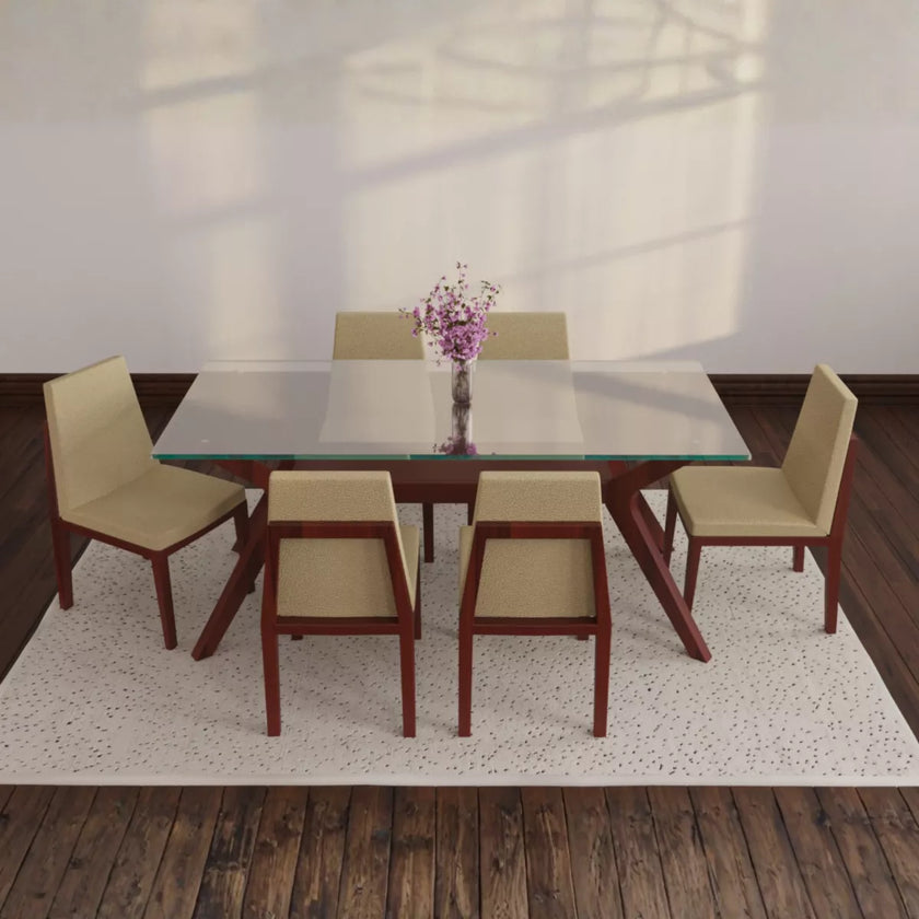 Dining table set with six chairs in a room with wooden floor and white walls.