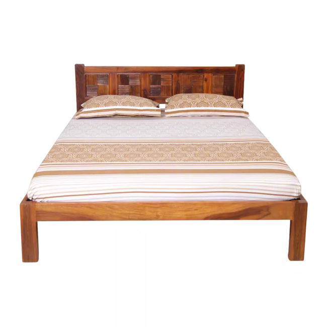 Wooden bed with striped bedding on a white background