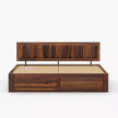 Wooden bed frame with storage drawers on a white background