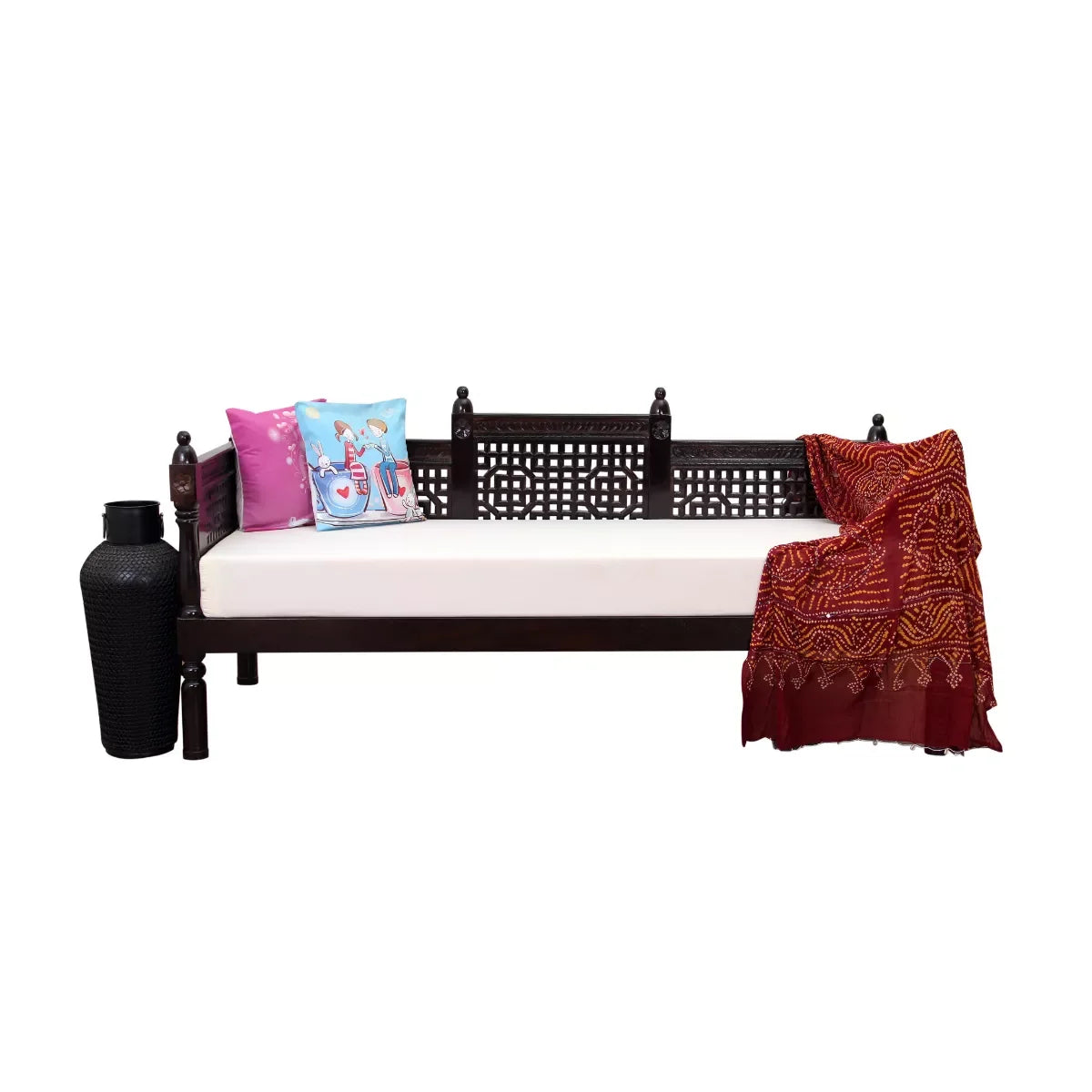 Traditional wooden daybed with cushions and a blanket on a white background