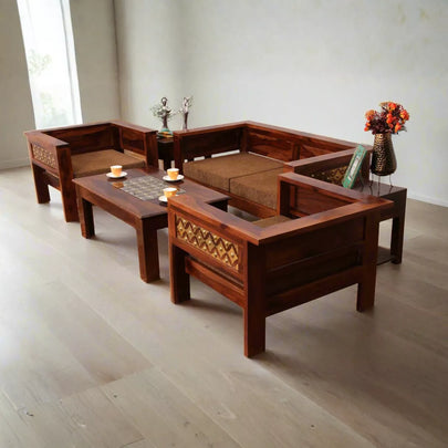 Wooden living room furniture set with decorative items on a light wooden floor.