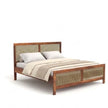 Wooden bed with wicker headboard and footboard on a white background