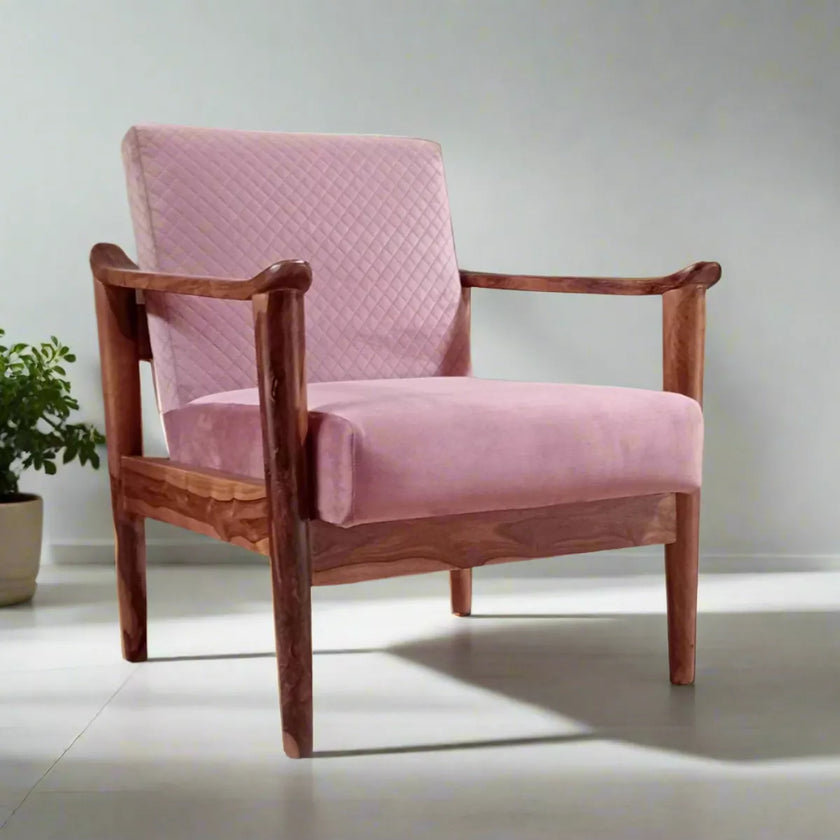 Pink sofa armchair with wooden frame on a light gray background