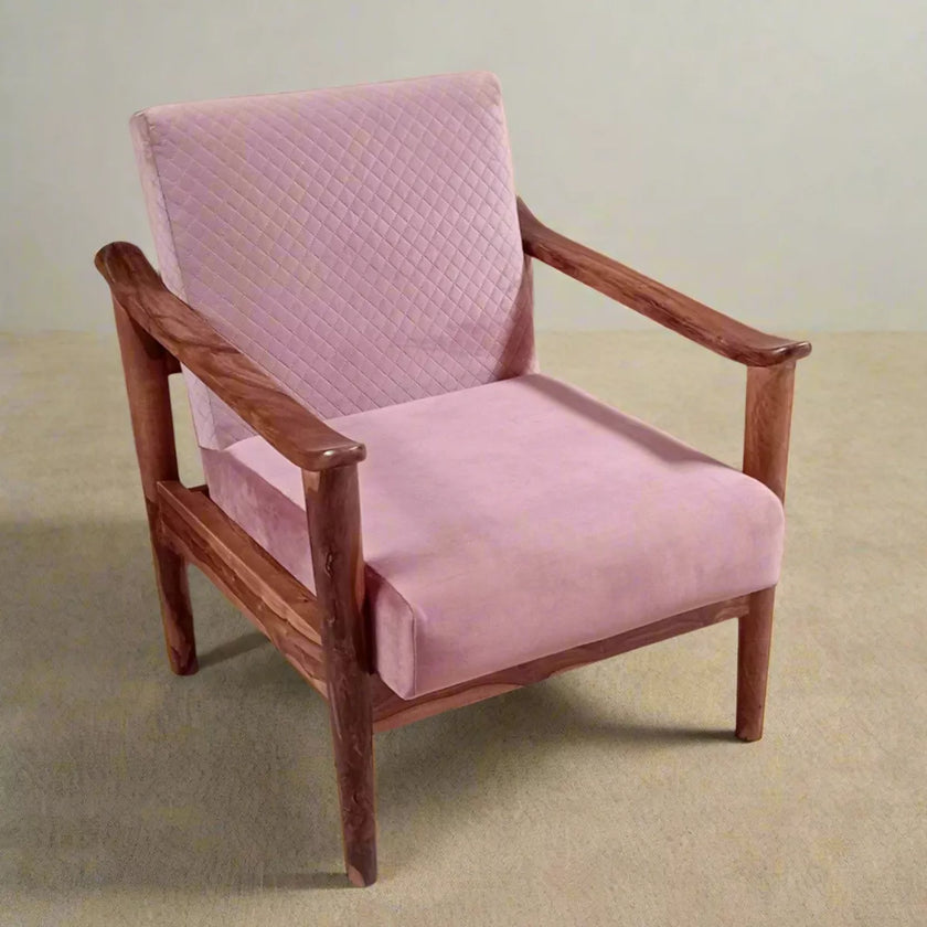 Pink sofa chair with wooden frame on a beige floor and light gray wall background