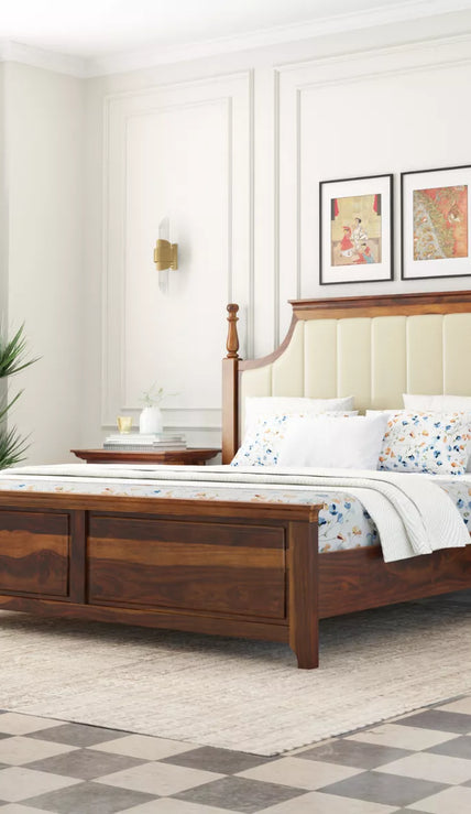 Wooden bed in a bedroom with white walls and decorative elements.