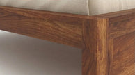 Solid Wood Bed Frame with Slatted Headboard in a White Background, Closeup View of Footboard