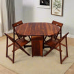 Wooden foldable dining table with four chairs in a room setting.