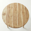 Round wooden table on a white background