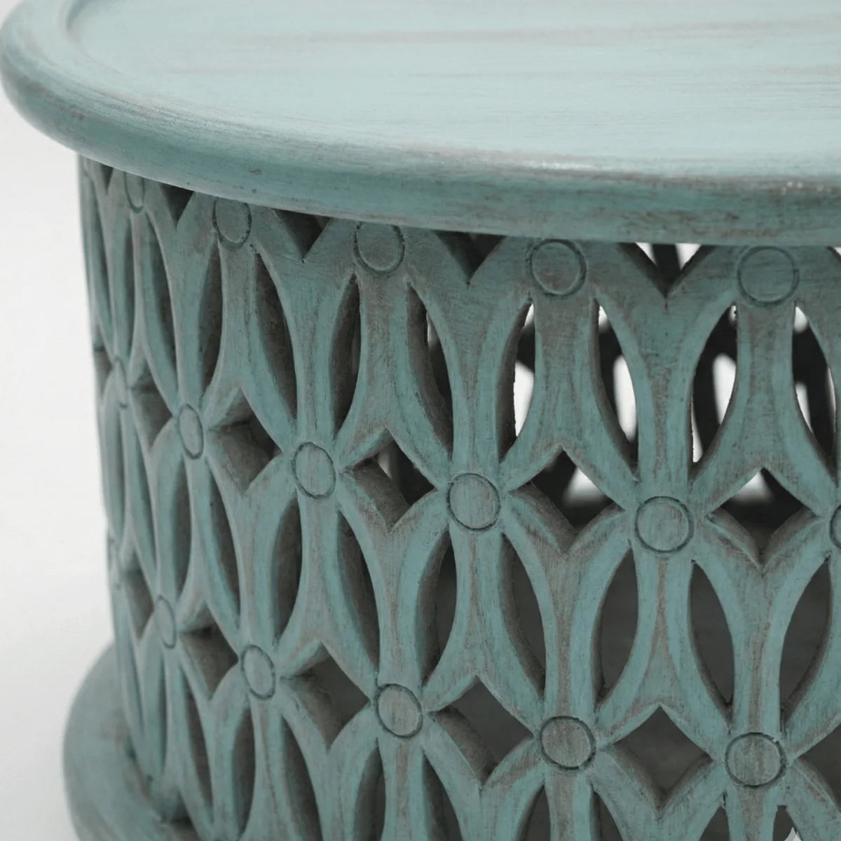 Close-up of hand carved jali work on Aarav blue distressed coffee table