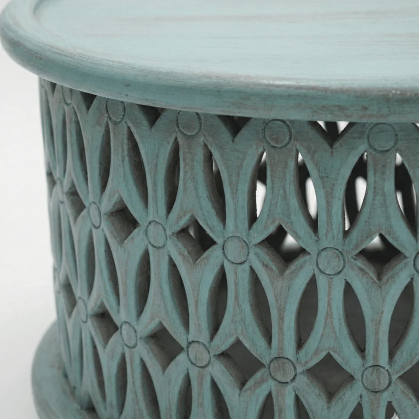 Close-up of hand carved jali work on Aarav blue distressed coffee table
