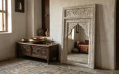 Angled view of the Aariz hand-carved Mughal arch wall mirror showing the carved frame