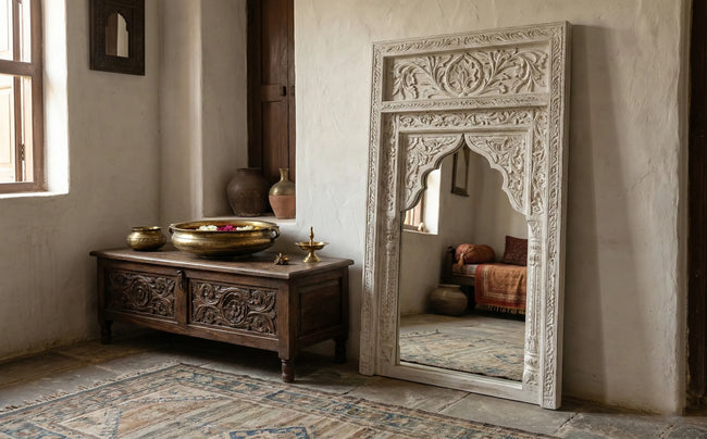 Angled view of the Aariz hand-carved Mughal arch wall mirror showing the carved frame