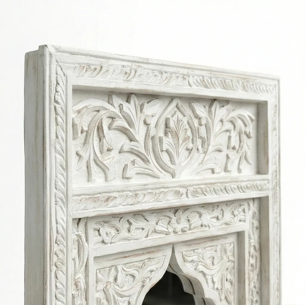 Close-up of the carved border pattern on the Aariz mirror frame