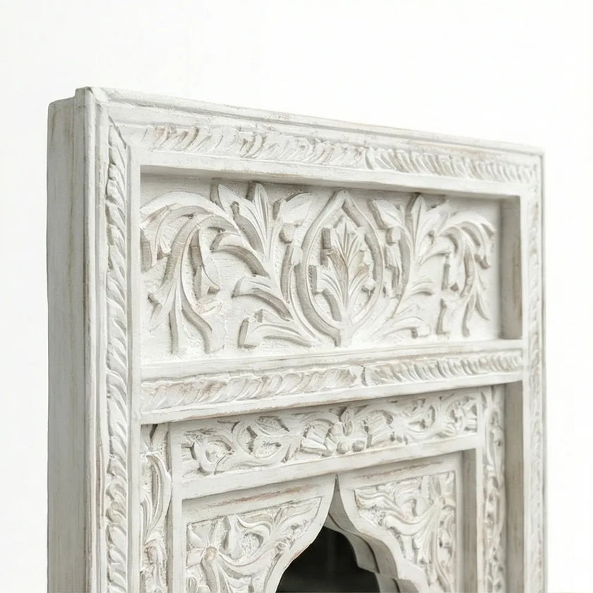 Close-up of the carved border pattern on the Aariz mirror frame