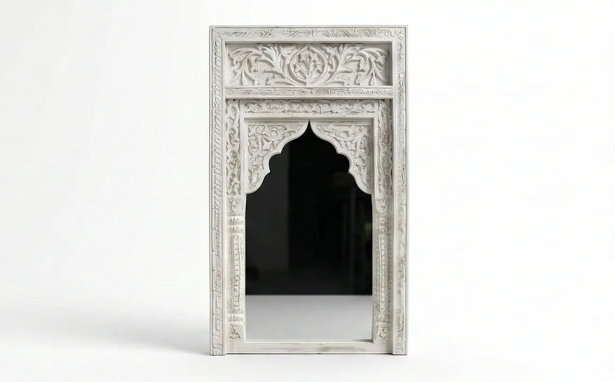 Close-up of the hand-carved detailing on the Aariz Mughal arch mirror frame