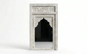 Close-up of the hand-carved detailing on the Aariz Mughal arch mirror frame