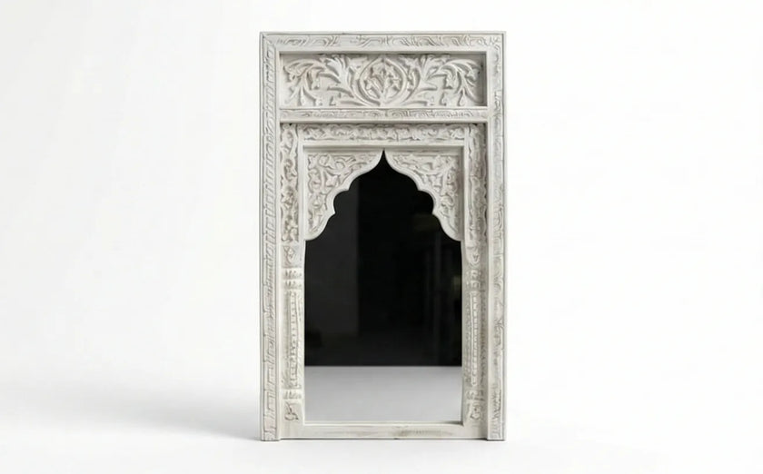 Close-up of the hand-carved detailing on the Aariz Mughal arch mirror frame