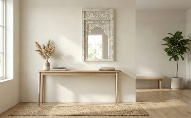 Front view of the Aariz hand-carved Mughal arch wooden wall mirror in distressed vintage white