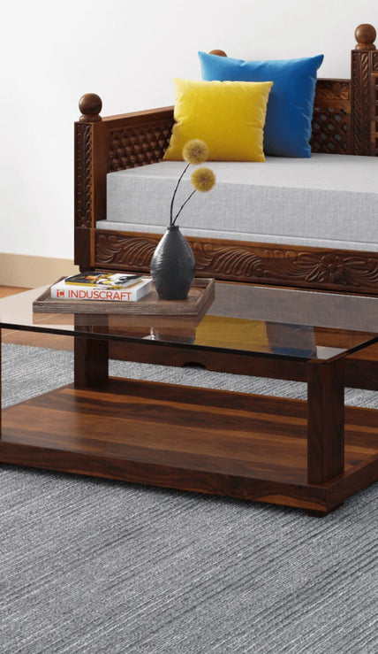 Aeron modern rectangular sheesham wood coffee table with glass top in a living room