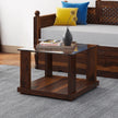 Aeron small square sheesham wood coffee table with glass top in a living room