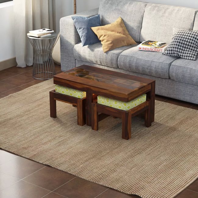 Antilia sheesham coffee table with 2 cushioned stools beside a grey sofa