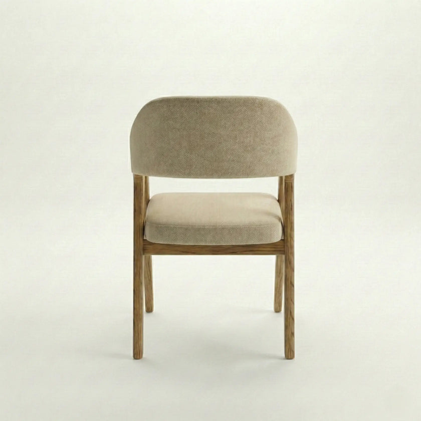 Back view of Brendon solid wood dining chair with curved upholstered backrest and cushioned seat.