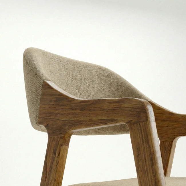 Close-up detail of Brendon solid wood dining chair armrest and upholstered backrest.
