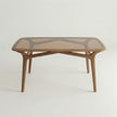 Front view of Brendon wood and glass dining table with sculpted wooden base.