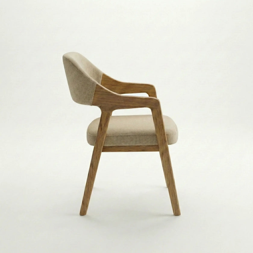 Side view of Brendon upholstered dining chair with solid wood frame and cushioned beige fabric seat.