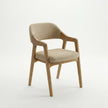 Angled view of Brendon wooden dining chair with upholstered seat and sculpted armrest design.