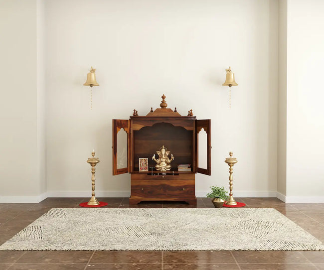 Divine sheesham wood pooja mandir for homewith glass doors and drawer placed against the wall premium interior zoom-out view