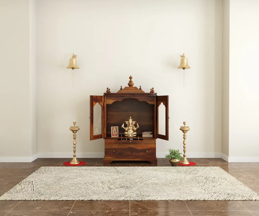 Divine sheesham wood pooja mandir for homewith glass doors and drawer placed against the wall premium interior zoom-out view