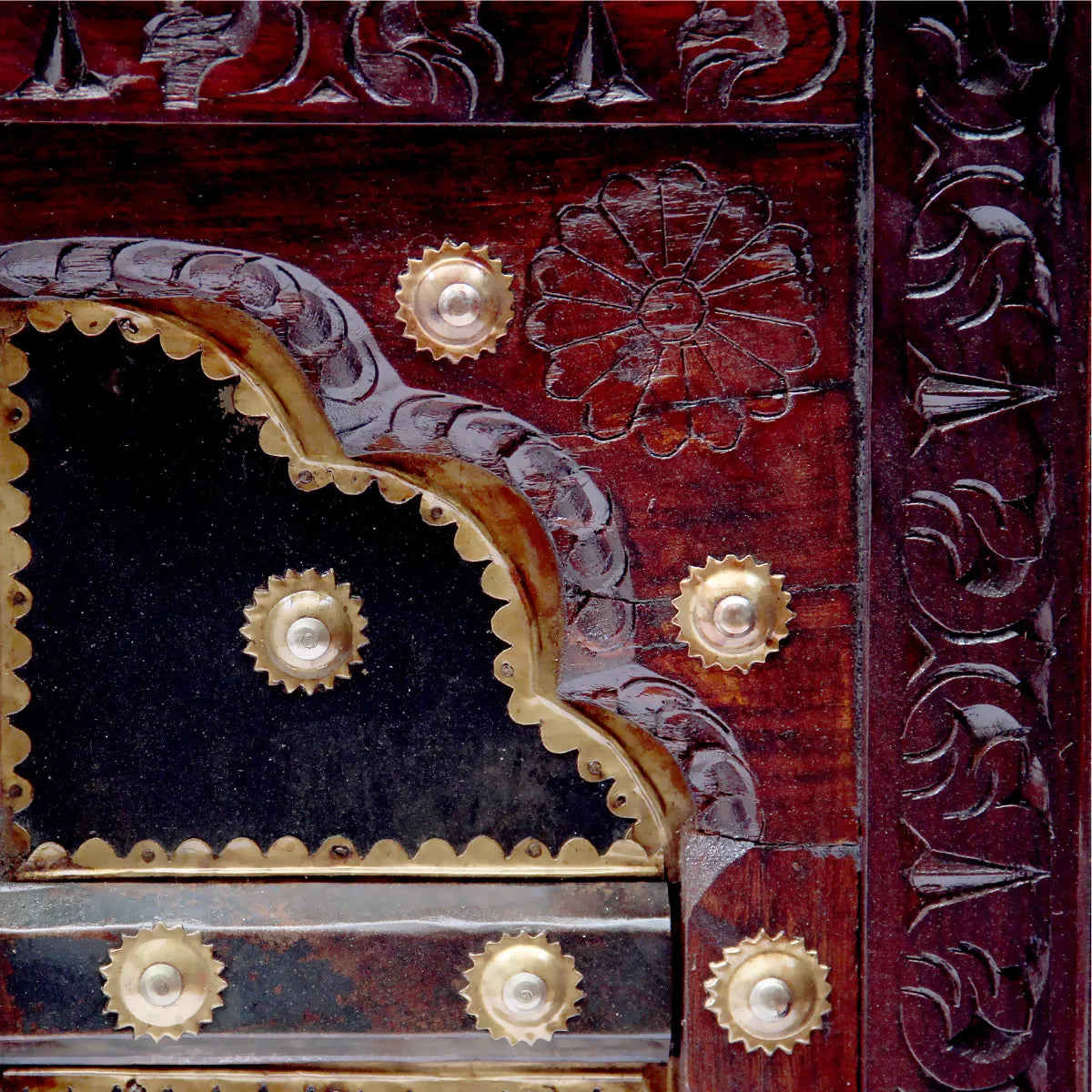 Hand carved wood and brass detail of door panel inspired center table