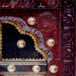 Hand carved wood and brass detail of door panel inspired center table