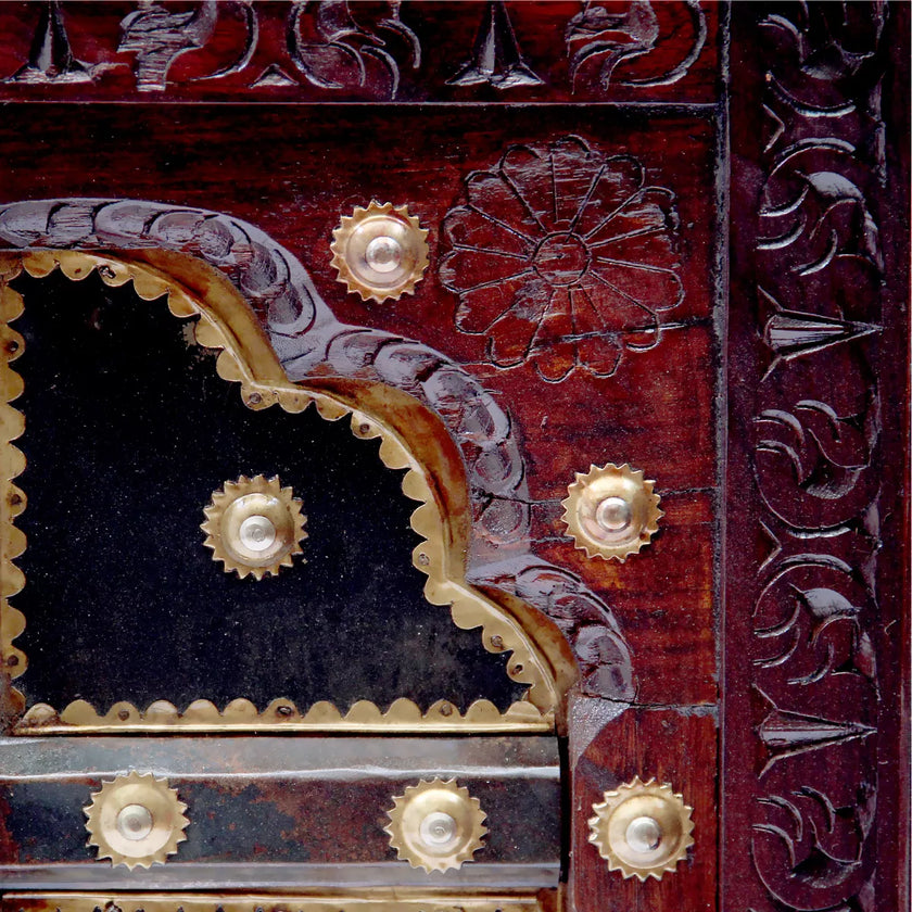 Hand carved wood and brass detail of door panel inspired center table