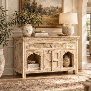 Jaalora living room sideboard styled with a table lamp, vases and books in the arched niches