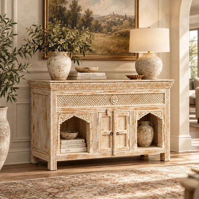 Jaalora living room sideboard styled with a table lamp, vases and books in the arched niches