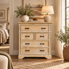 Kesara distressed wooden chest of drawers styled in a bedroom with a table lamp and vase on top